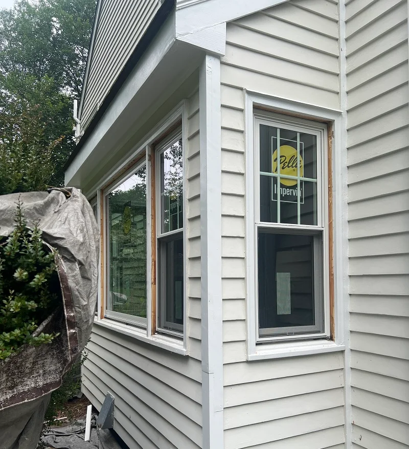 Pella Impervia replacement double hung windows being installed